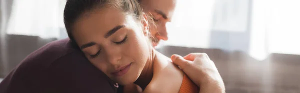 Upset woman with closed eyes embraced by beloved man, banner — Stock Photo