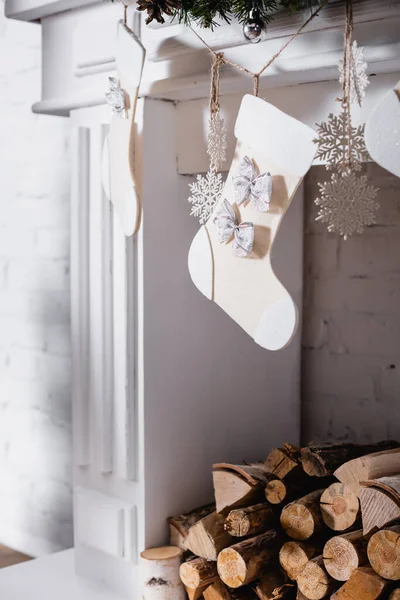 Fireplace decorated with christmas stockings and bauble — Stock Photo