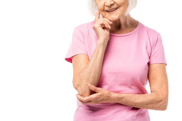 Cropped view of grey haired woman in pink t-shirt isolated on white, breast cancer concept — Stock Photo