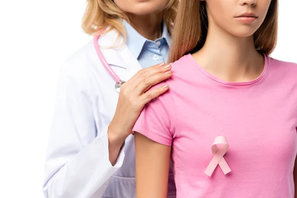 Cropped view of doctor hugging young woman with pink ribbon on t-shirt isolated on white — Stock Photo