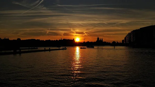 Here you can see breathtaking sunset above Amstel river in Amsterdam, Netherlands