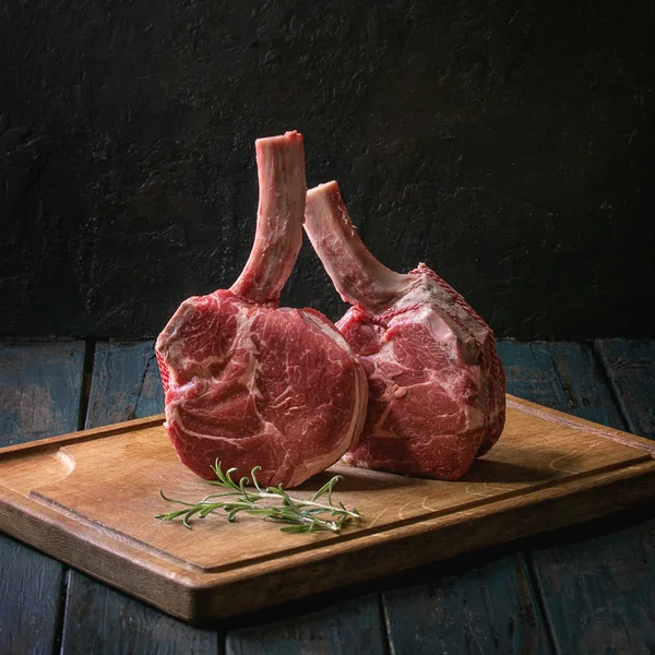 Raw Uncooked Black Angus Beef Tomahawk Steaks Bones Served Rosemary — Stock Photo, Image