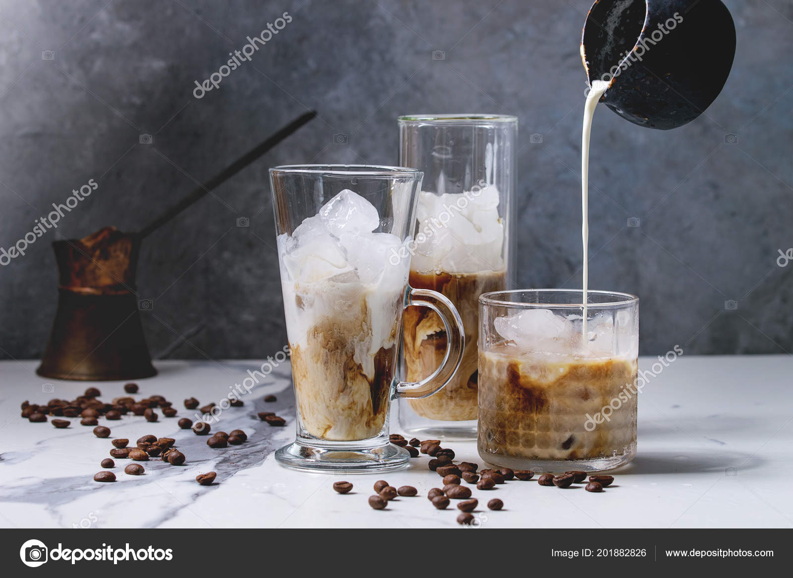 pour the frappe from the shaker into a tall glass , beautiful and