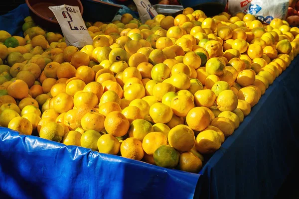 Turkish farmer market. Heap of fresh organic fruits on the counter oranges, tangerines