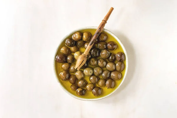 Green olives in olive oil — Stock Photo, Image