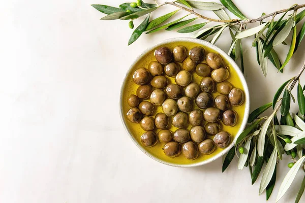 Green olives in olive oil — Stock Photo, Image