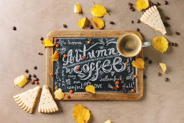 Autumn coffee with yellow leaves