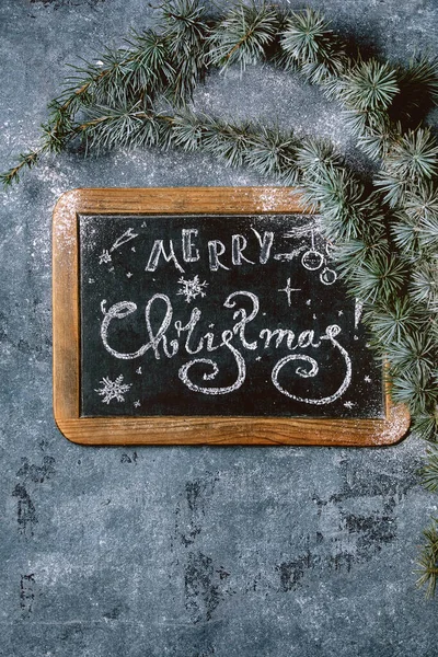 Christmas lettering on chalkboard — Stock Photo, Image