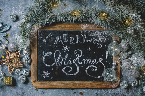 Christmas lettering on chalkboard — Stock Photo, Image