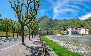 An avenue in the spring in the village of san pellegrino terme clipart