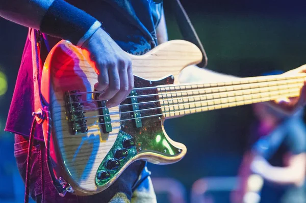 5-string bass player during a live show