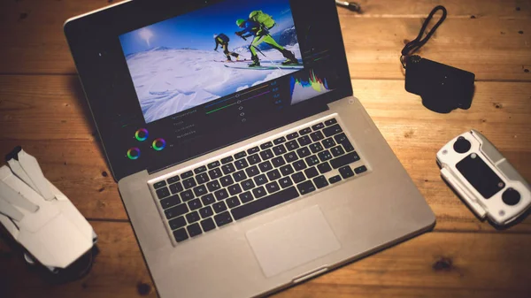Portable computer for mobile video editing station, after shooting with drone