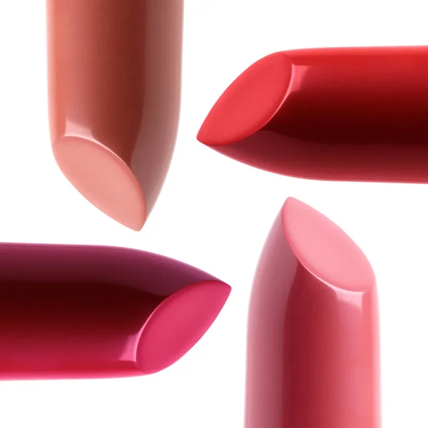 Closeup view of four different colored lipsticks — Stock Photo, Image