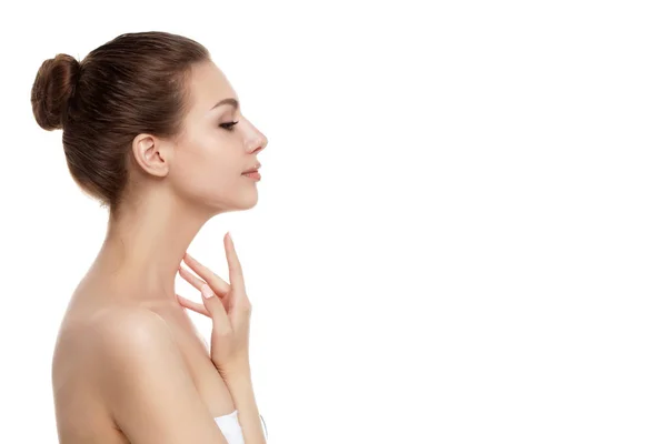 Young beautiful woman touching her neck — Stock Photo, Image