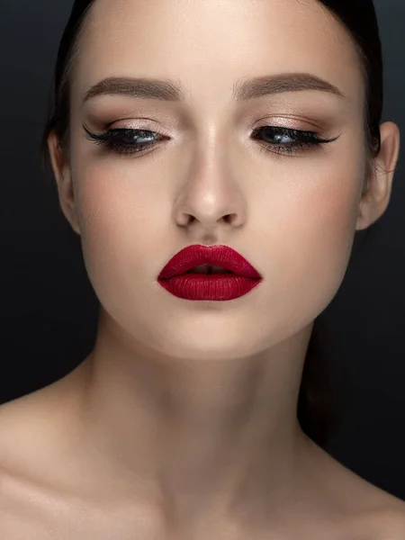 Portrait of young beautiful woman with red lips — Stock Photo, Image