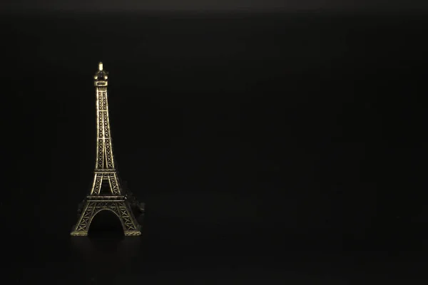 Eiffel tower isolated on black background.