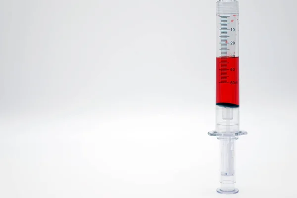 Syringe with blood isolated on white — Stock Photo, Image