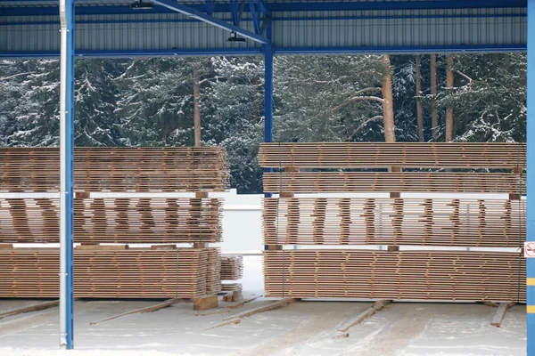 Lumber warehouse.New Stacked pallets .