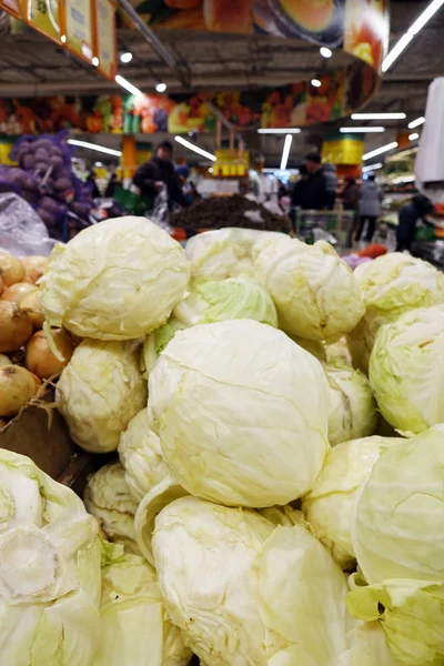 Trade vegetables in the store .cabbage at the grocery store or market.Vegetables in baskets.