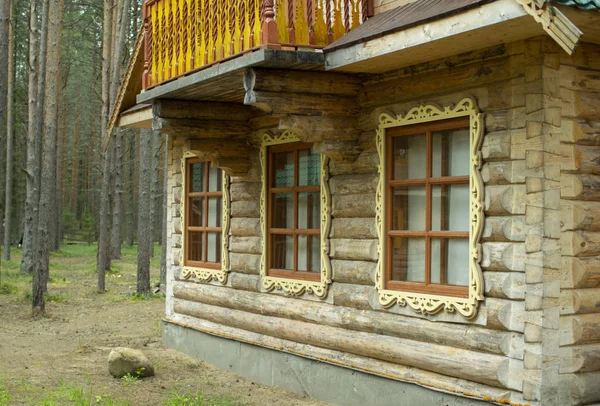 Wooden log house. Window with shutters of a wooden house — Stock Photo, Image