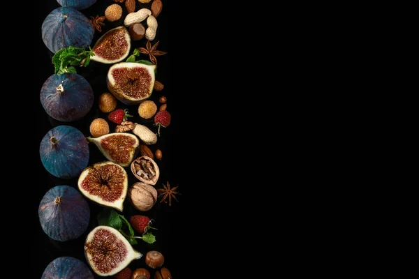 Healthy fats, clean eating for weight loss. Fresh figs. Food Photo. Creative scheme of the whole and sliced figs black background, inscribed in a rectangle. View from above. Copy space