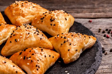 Asian food Samsa or samosas with chicken fillet on cutting board. Food recipe background. Close up.
