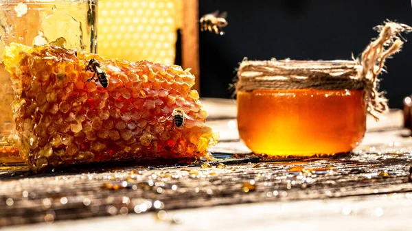 Close up. working bees on honey cells. Bees produce fresh, healthy, honey. Honey background. Beekeeping concept. Long banner format.