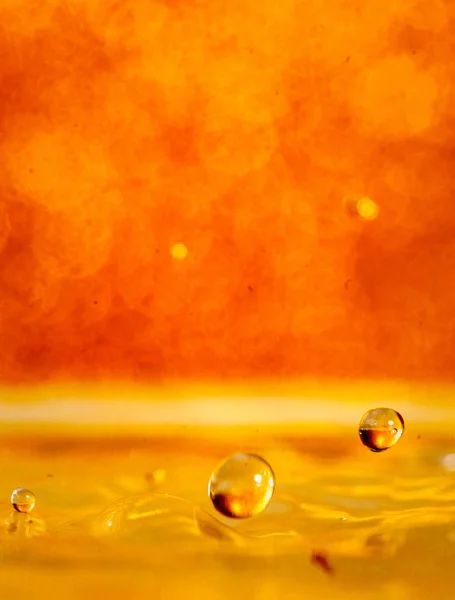 Golden Drop Splash Fotografie Stockfoto