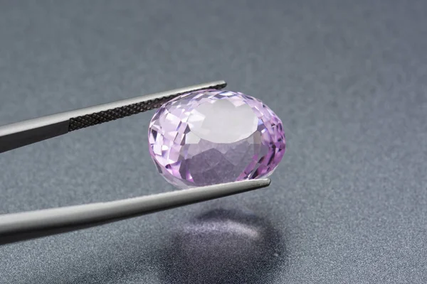Glossy Transparent Purple Gemstone Fastened Tweezers — Stock Photo, Image