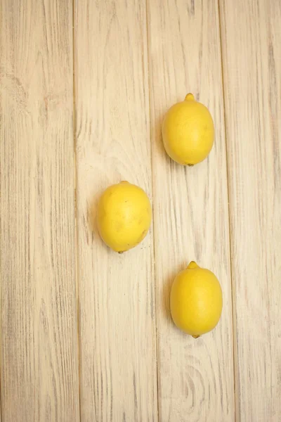 Three lemons on white background
