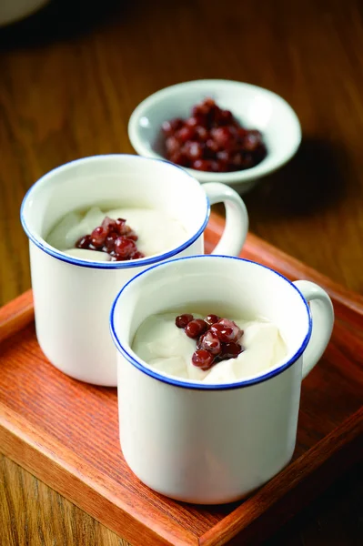 Red bean and bean curd in a white cup