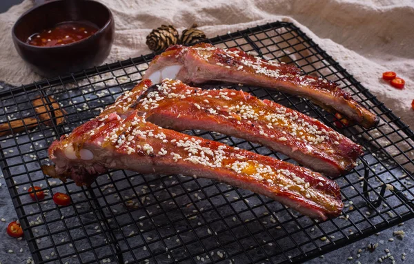 Reserved baked ribs in the barbed wire