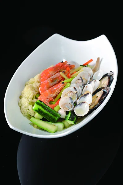 Various seafood platter in a white dish