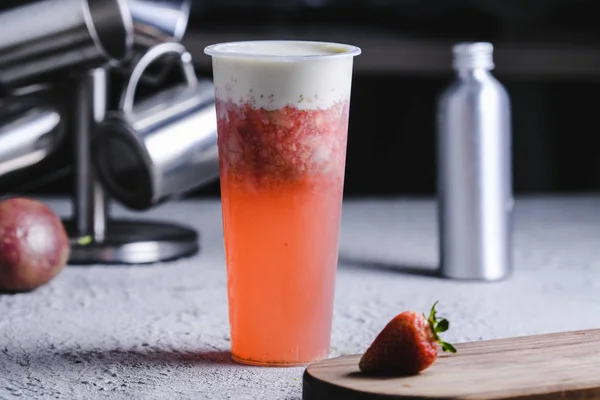 Strawberry soda covered milk in a clean glass