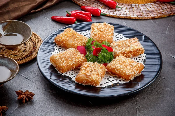 Fried turnip cake in a black dish