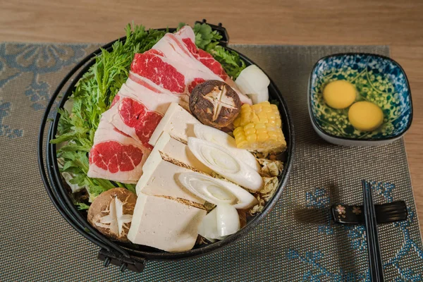 Fat beef hot pot with blue and yellow eggs in Japanese style