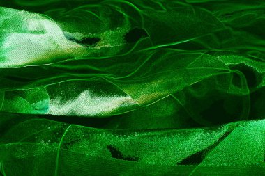 Yumuşak yeşil renkli kumaş doku parıldıyor