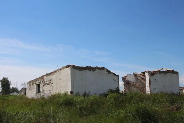 destroyed abandoned buildings ruins with Windows in a non-residential village