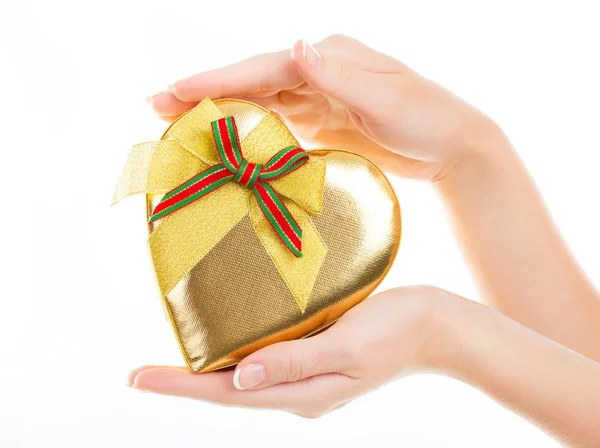 Female Hands Holding Beautiful Golden Gift Box Red Bow Isolated — Stock Photo, Image