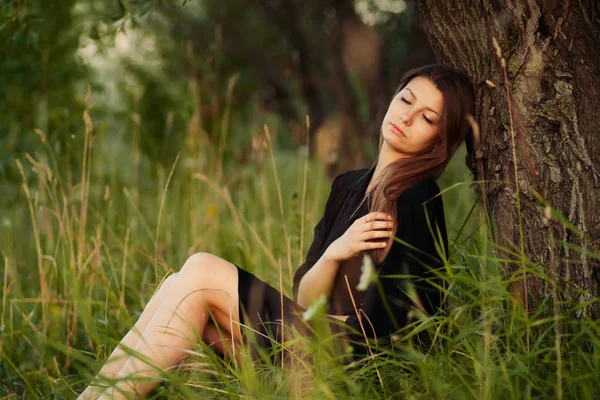 Carefree Young Woman Lying Grass Tree Summer Lawn Stock Photo