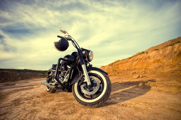 Big, clean, black and unknown chopper bike in desert — Stock Photo, Image