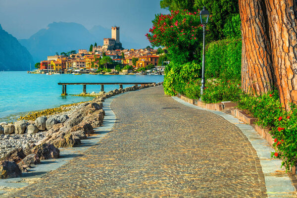Beautiful Malcesine touristic resort with lake shore and decorated walkway, lake Garda, Veneto, Italy, Europe