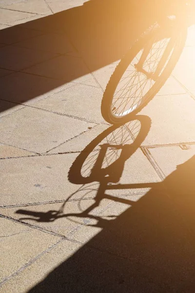 bicycle transportation shadow silhouette on the ground in the street