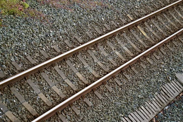 old train tracks in the station in the street