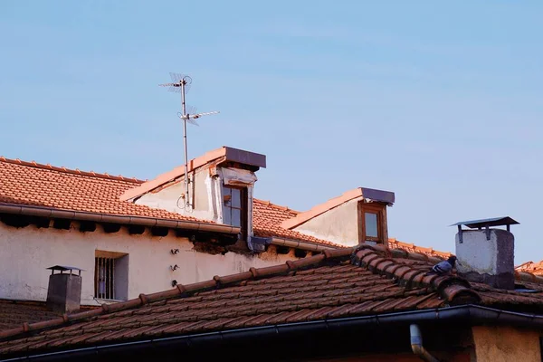 television aerial on the building rooftop in bilbao city Spain.