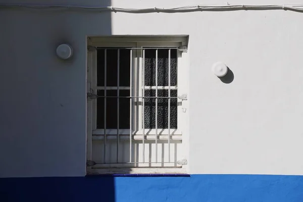 window on the white building facade in Bilbao city Spain