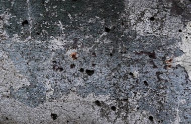 Yüksek çözünürlükte yaşlı yıpranmış çimento duvarlarında çatlaklar yakın çekim