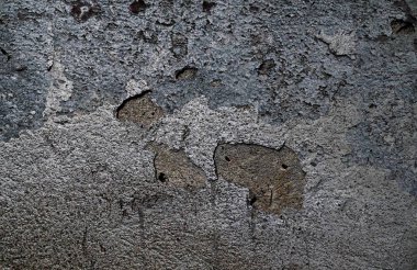 Yüksek çözünürlükte yaşlı yıpranmış çimento duvarlarında çatlaklar yakın çekim