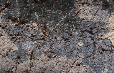 Yüksek çözünürlükte yaşlı yıpranmış çimento duvarlarında çatlaklar yakın çekim