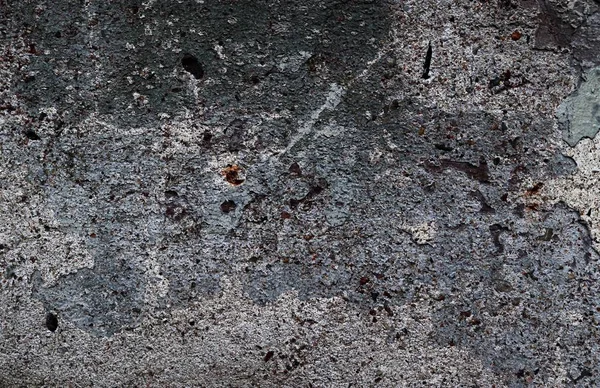 Yüksek çözünürlükte yaşlı yıpranmış çimento duvarlarında çatlaklar yakın çekim